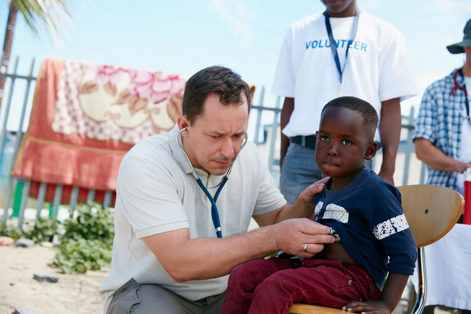 shot-of-a-volunteer-doctor-examining-a-young-patie-2022-10-05-07-52-38-utc
